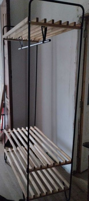 Wood and metal clothes hanging rail