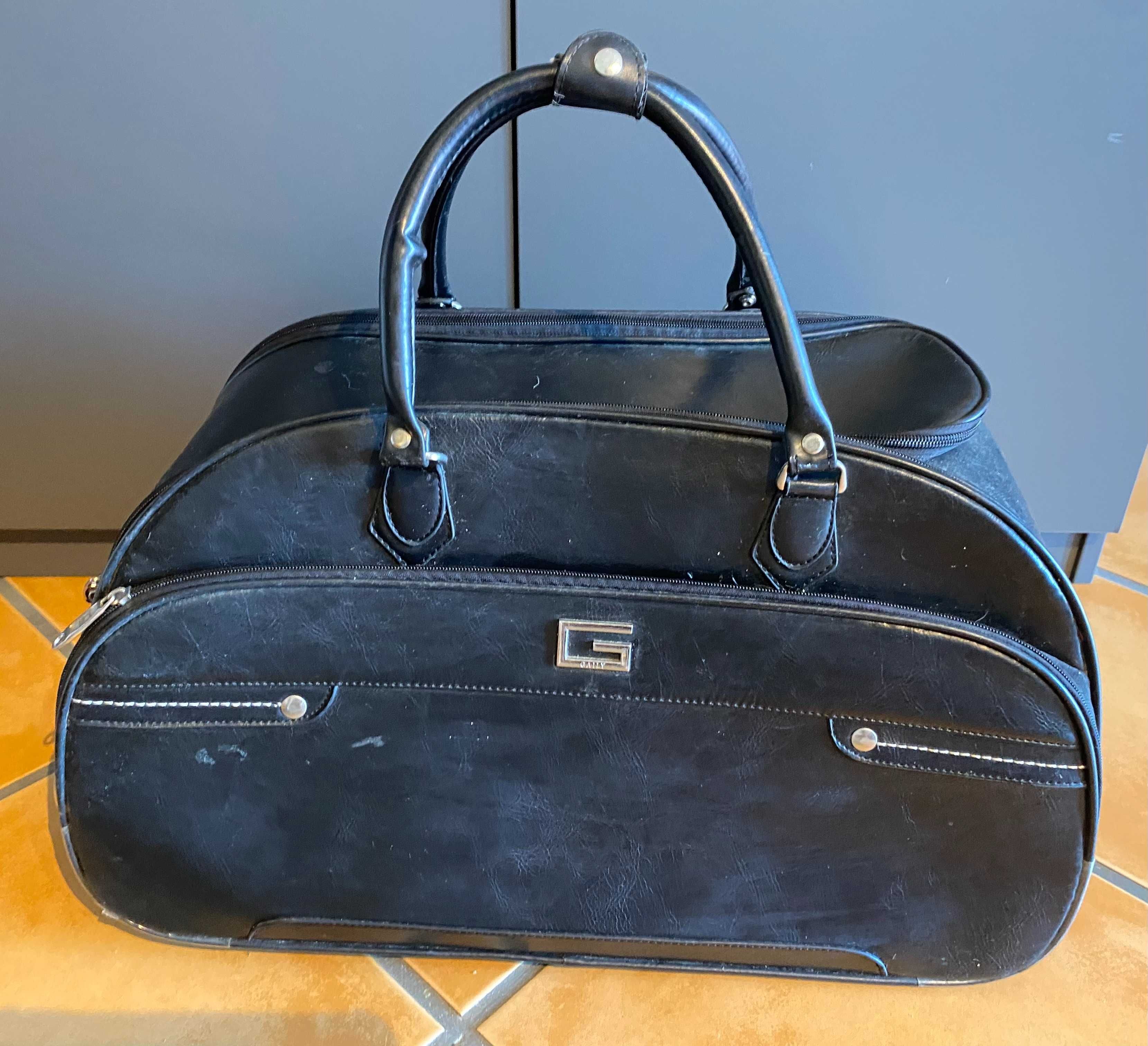 Black travel bag on wheels