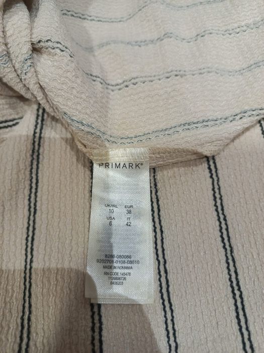 Macacão beje riscas