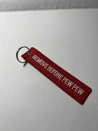 BRELOK smycz smyczka do kluczy REMOVE BEFORE