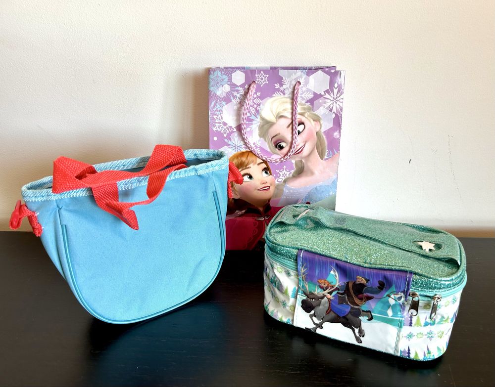 Mala, bolsa, estojo e 2 puzzles (100 peças) Frozen - Elsa e Anna