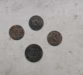 Moedas de 50 centavos e 1 escudo