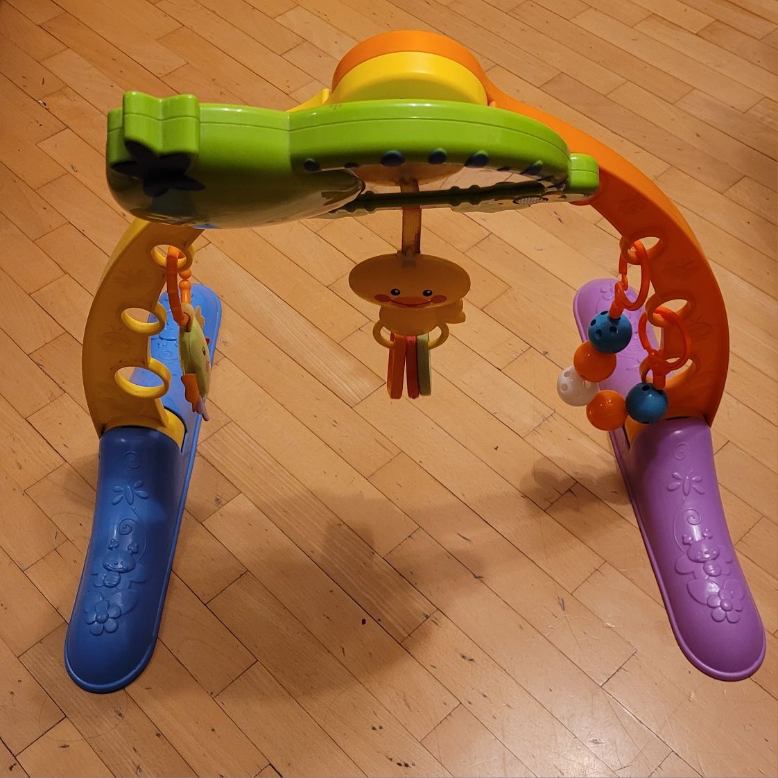 Fisher Price muzyczny przyrząd gimnastyczny pałąk