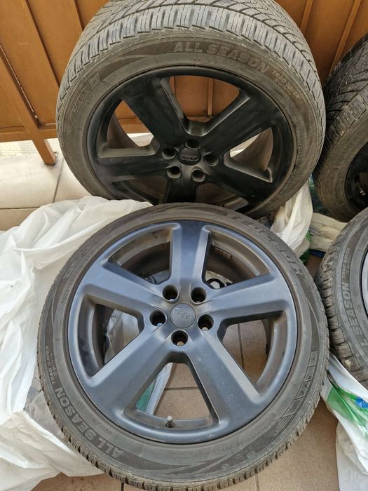 Alufelgi czarne 18 cali z oponami wielosezonowymi