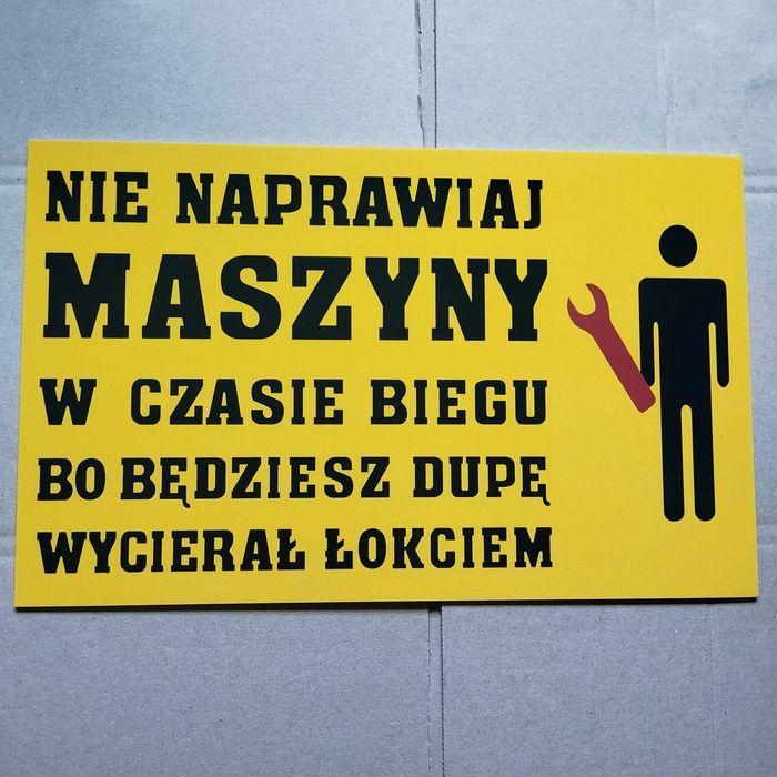 Tablica PRL Nie naprawiaj maszyny w czasie biegu bo... tablica pcv