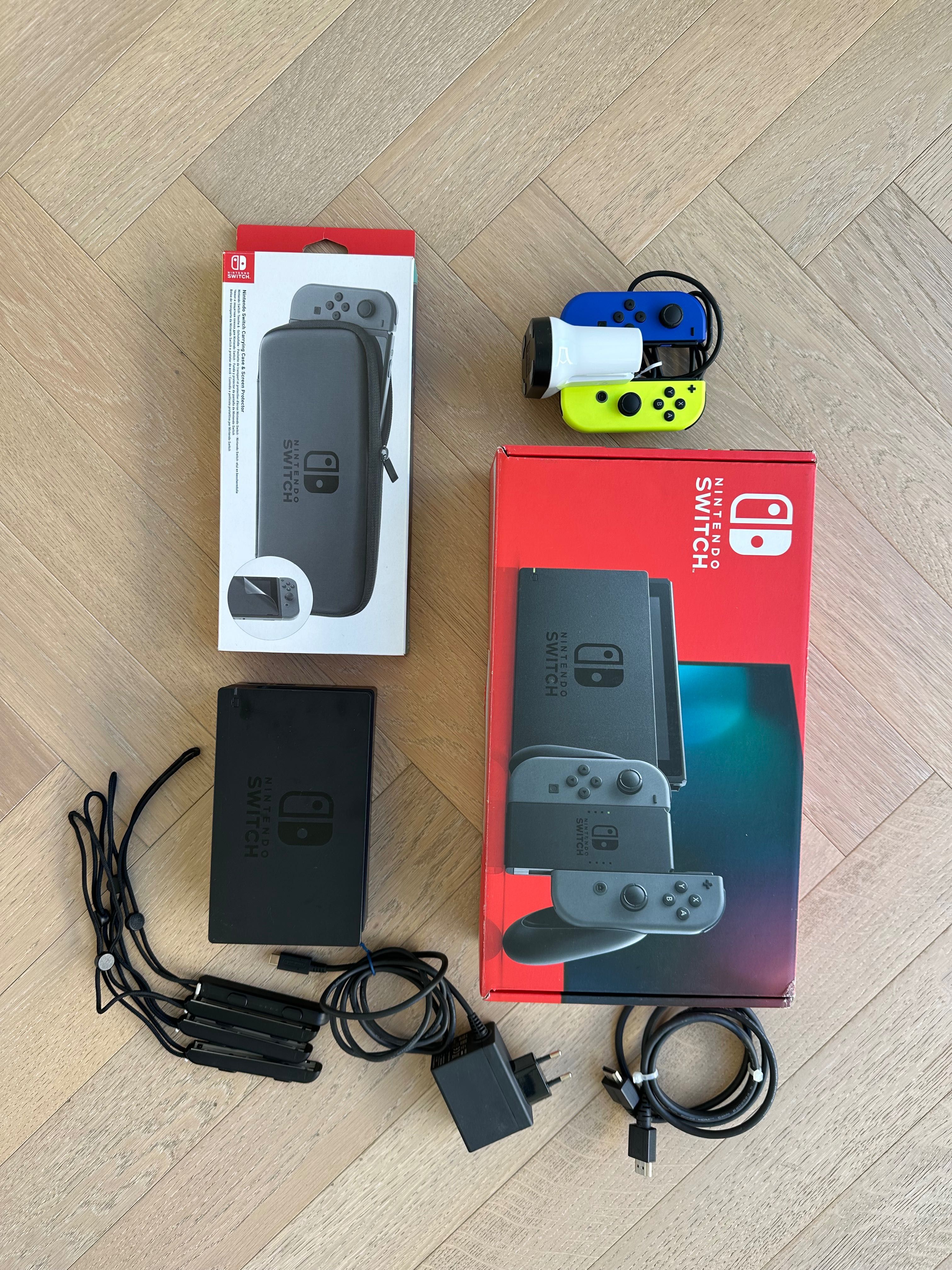 Nintendo Switch V1 + 2 comandos + charging dock
