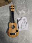 Ukulele zabawka dla dzieci 35 cm z kostką i strunami