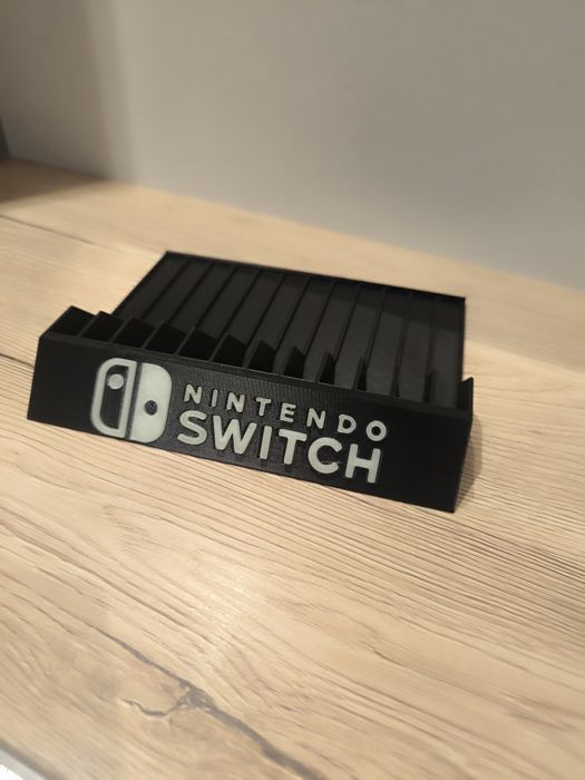 Stojak podstawka na gry Nintendo Switch napis fluorescencyjny