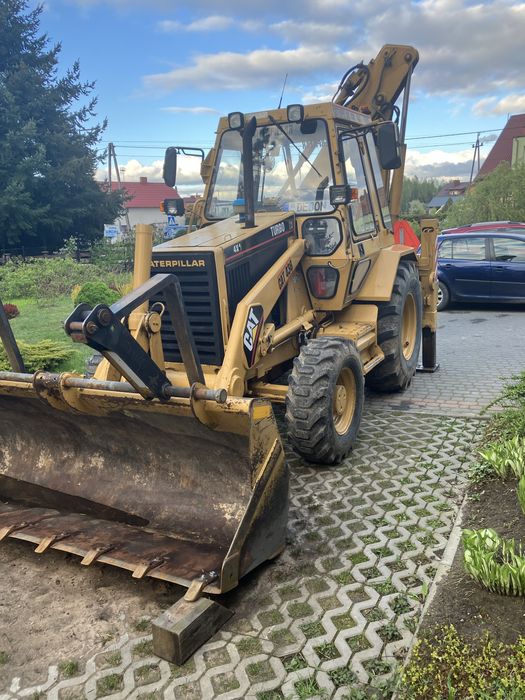 Koparko-ładowarka Caterpillar 438