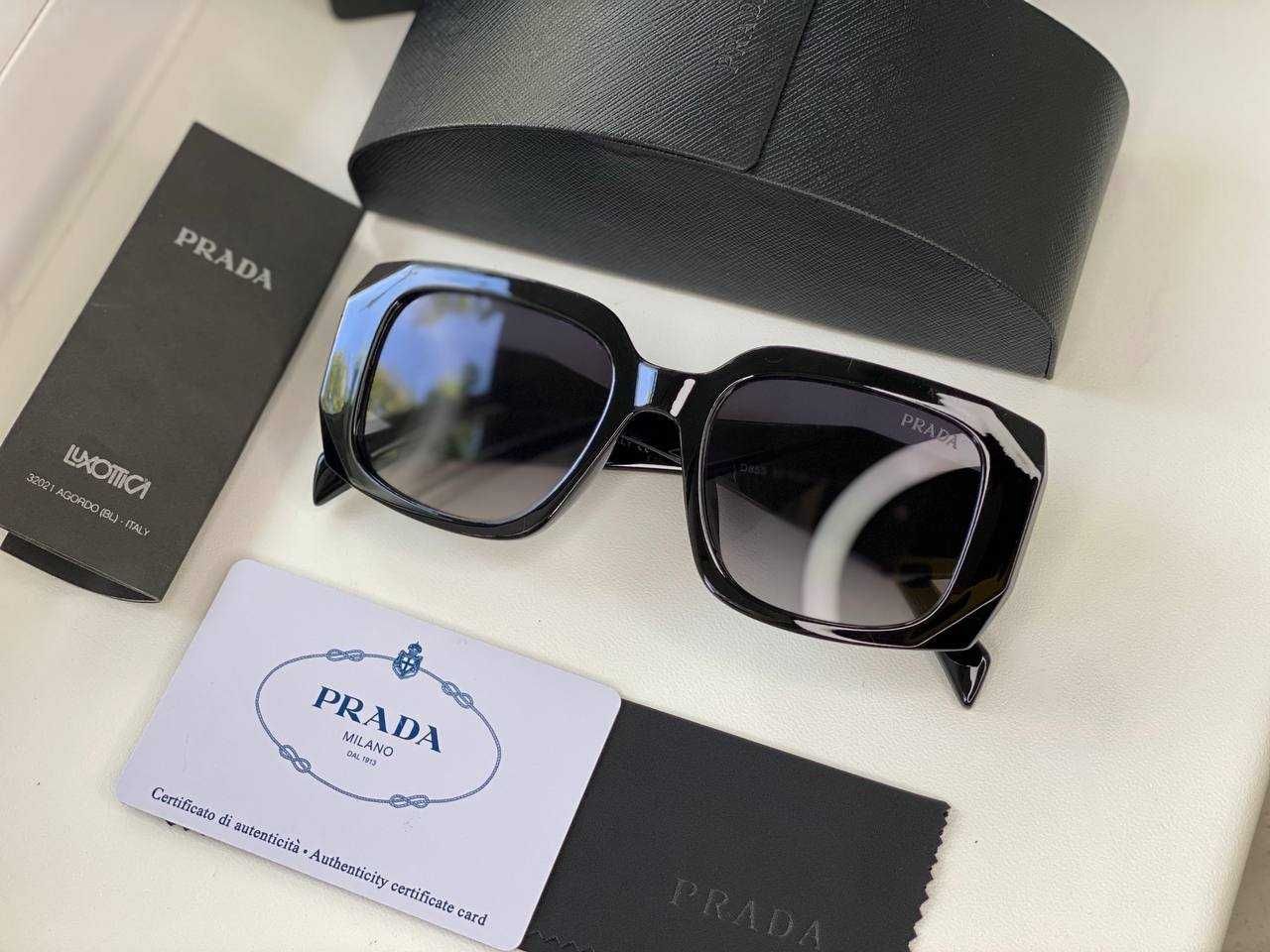 Солнцезащитные очки Prada.