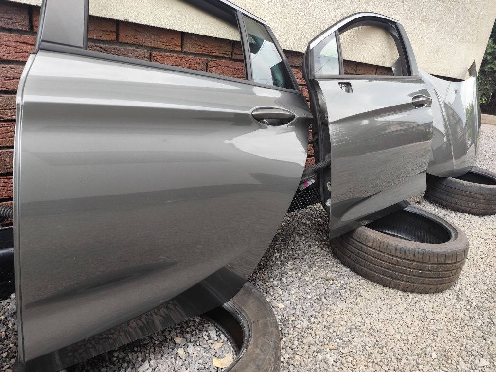 Drzwi lewy przód tył przednie tylne opel astra k kombi z10a