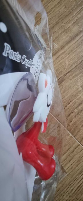 Uchwyt na szczoteczkę oraz wyciskacz pasty do zębów