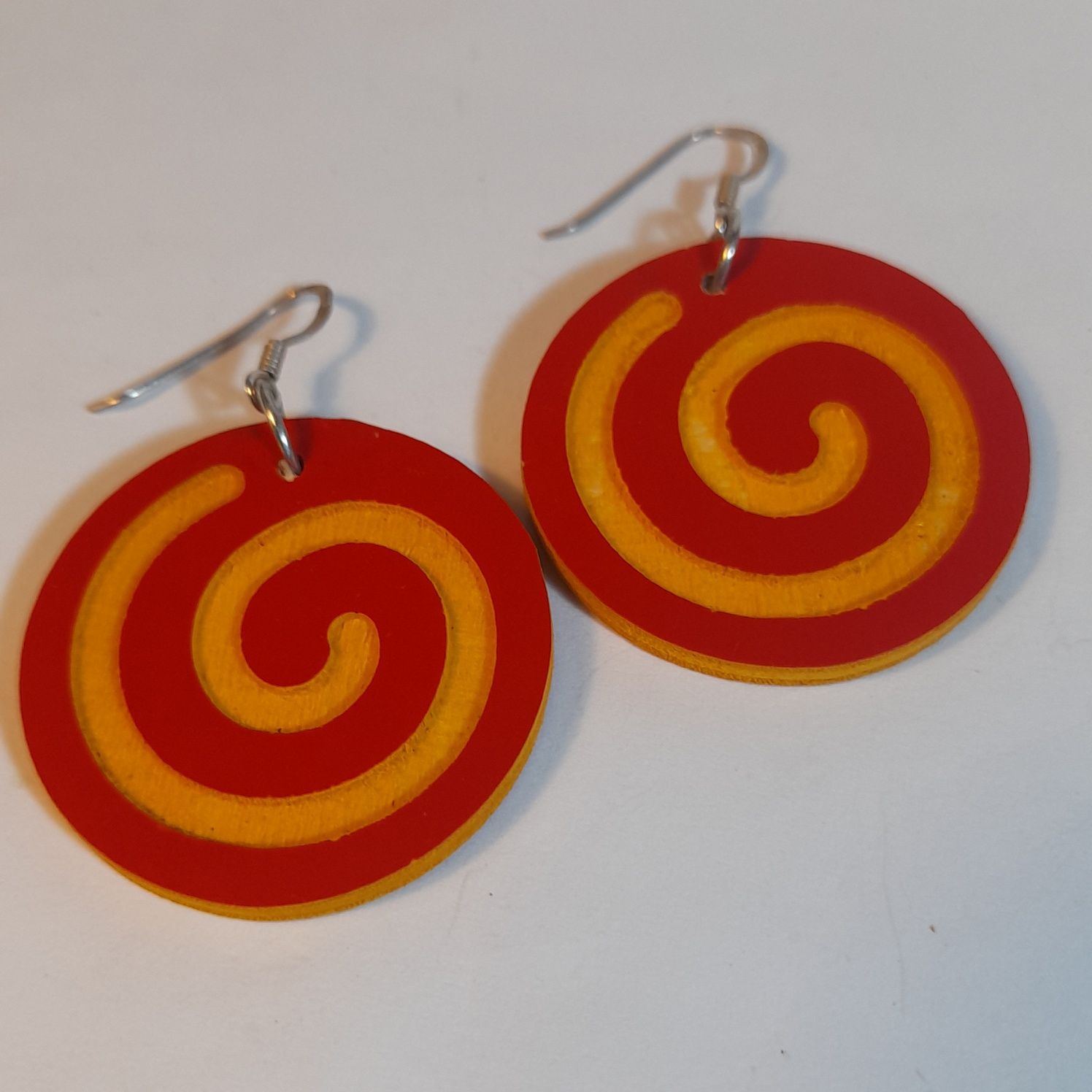 Wooden earrings in the shape of spirals.
