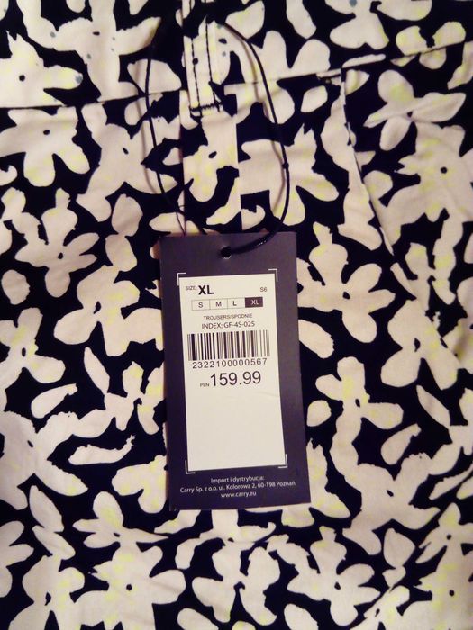 Spodnie w białe kwiaty w stylu chino marki Carry, rozm. XL