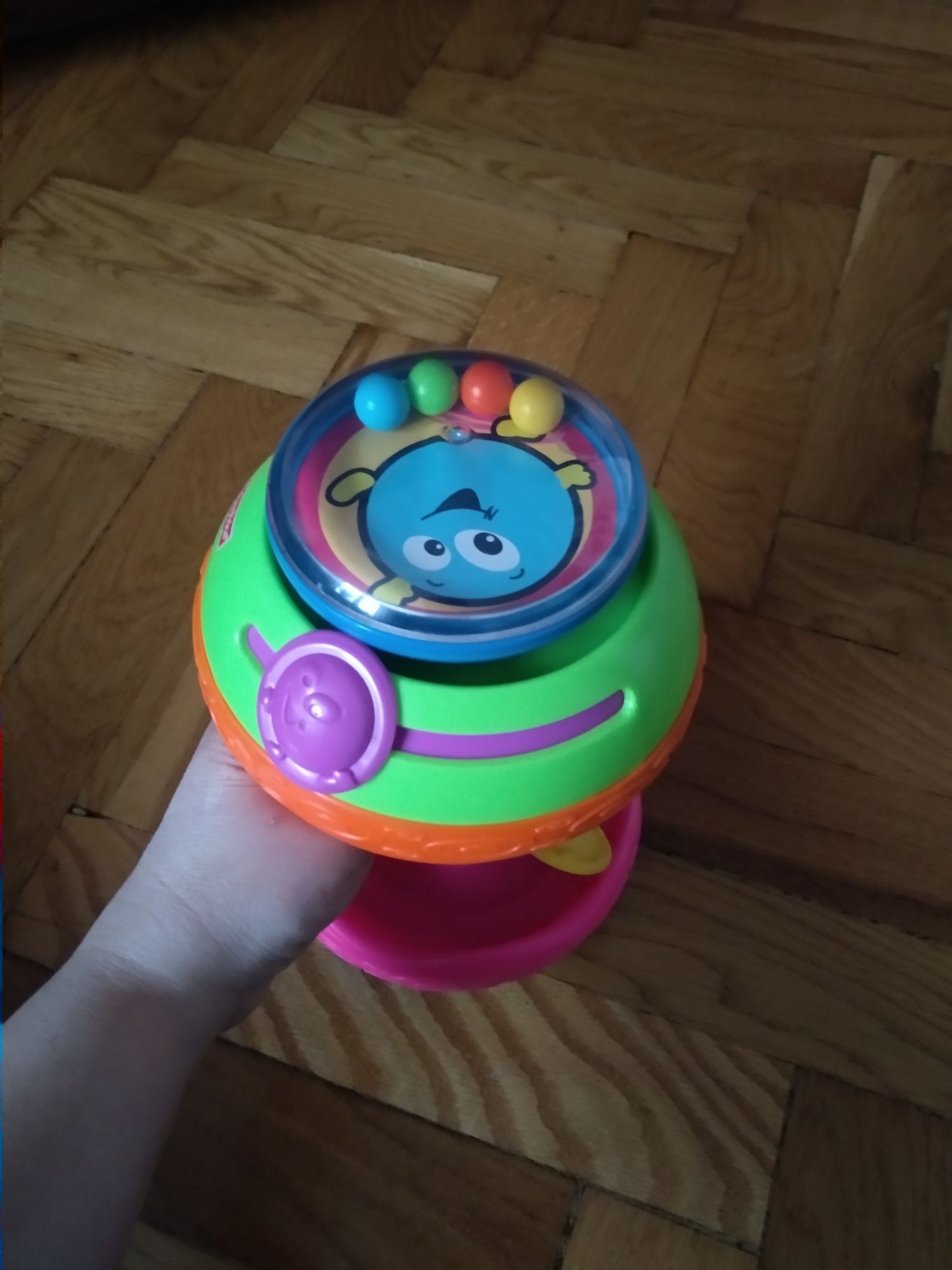 Grzechotka zabawka brzęczek Fisher Price kołowrotek z melodyjki