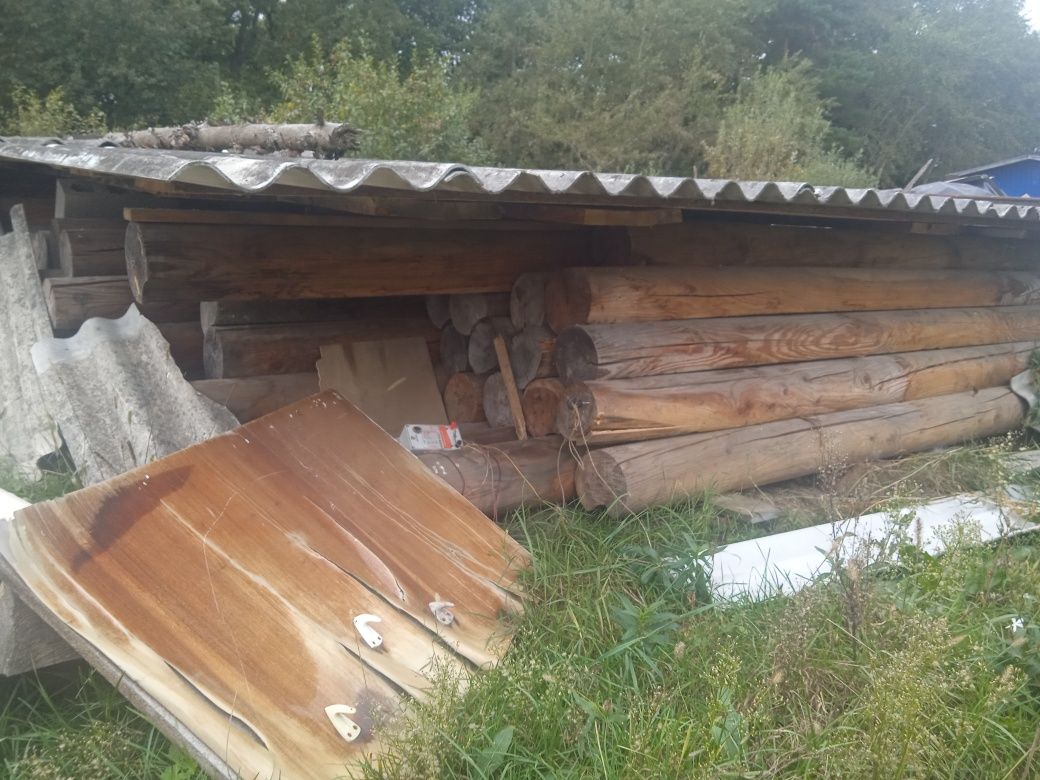 Брус круглий з модрини дерев'яний будинок