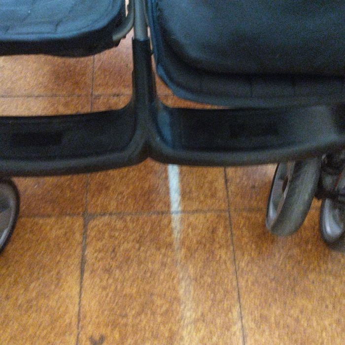 Carro de bebê de gêmeos