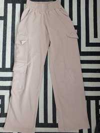 Spodnie dla dziewczynki nowe kolor beżowy rozmiar 146 cm