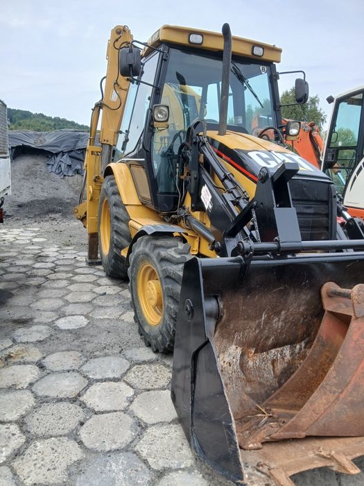 Koparko-ładowarka CAT 428D JCB CASE VOLVO