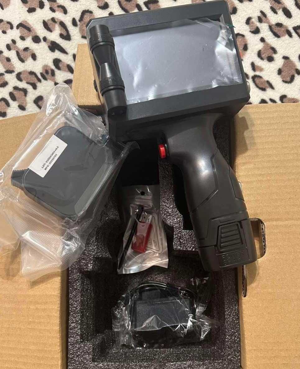 Handheld inkjet printer
