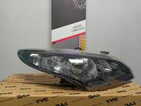 Renault Megane III 08-Lampa/Reflektor prawy czarny środek /H7+H7