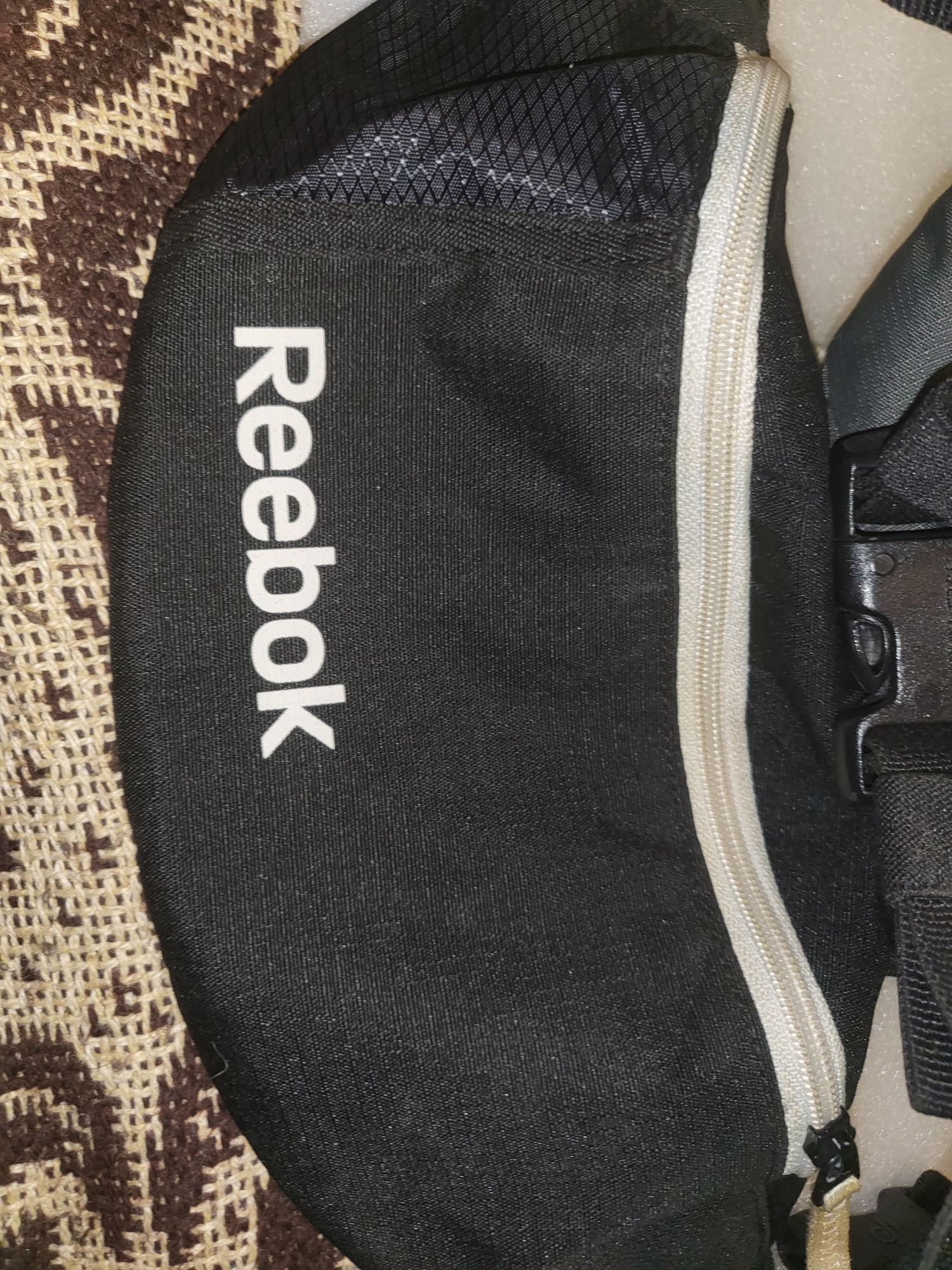 Szaszetki sportowe Reebok i Deuter