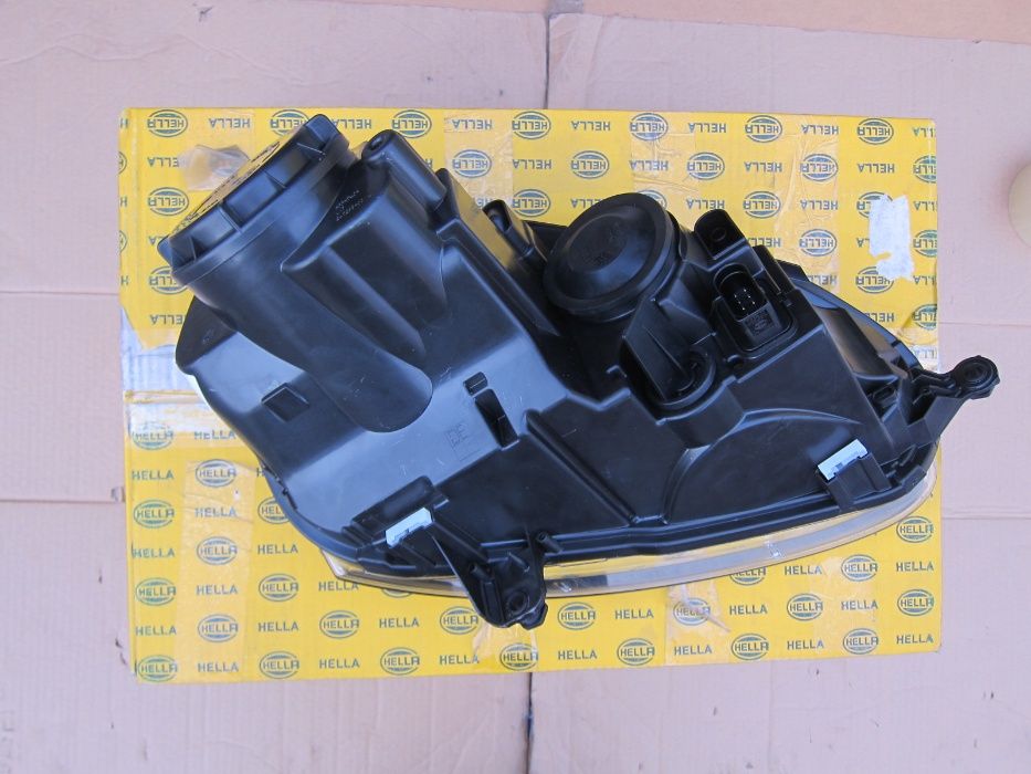 Фара Volkswagen Golf Jetta Гольф 5 V HELLA 1EG247007571