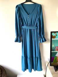 Niebieska sukienka rekawy falbana midi