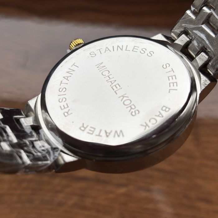 Жіночий годинник Michael Kors на браслеті комбінованого кольору