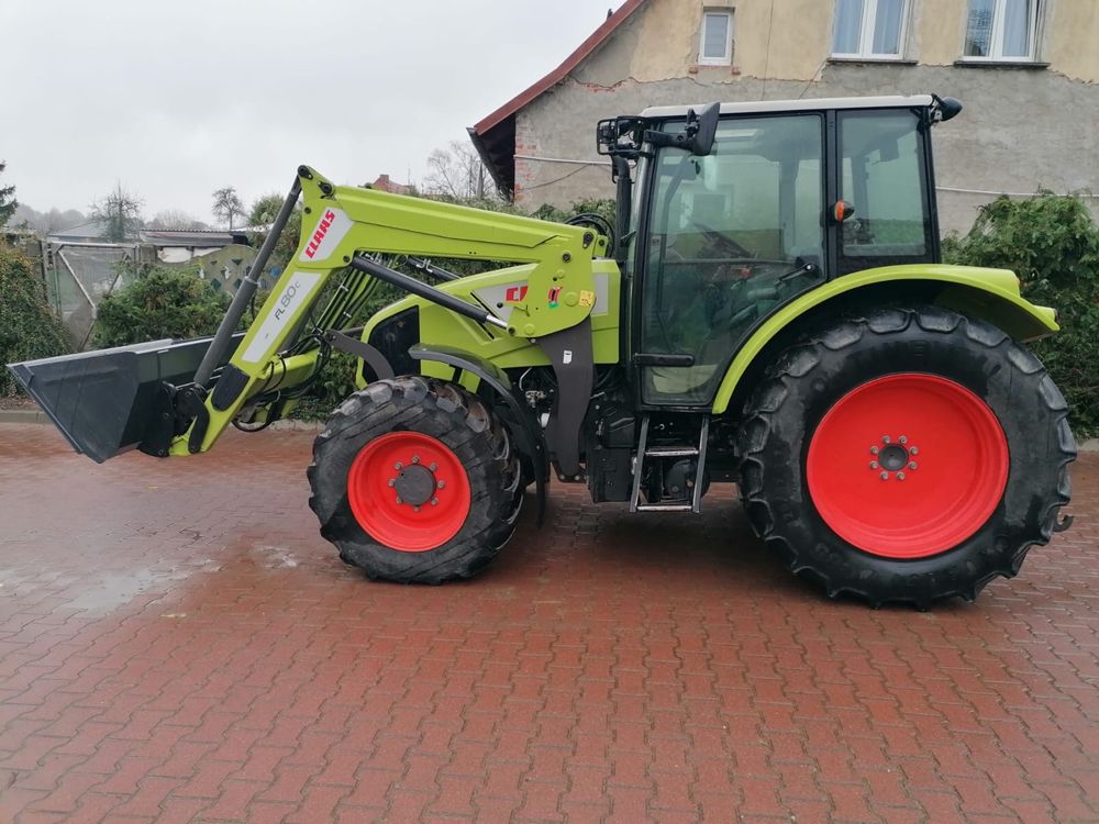 Claas Axos 310 z ładowaczem