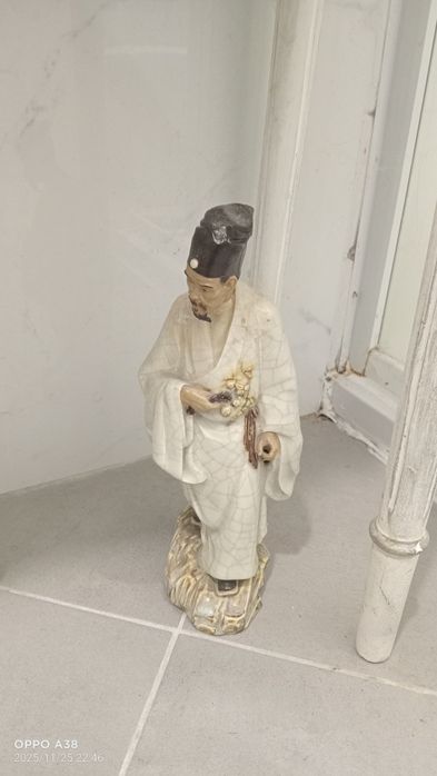 Figura de "mudman" chinesa, uma forma cativante de arte popular chines