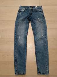 Spodnie jeansy Mohito 36