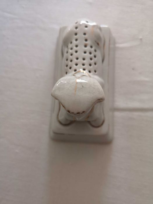 paliteiro antigo em forma de esfinge