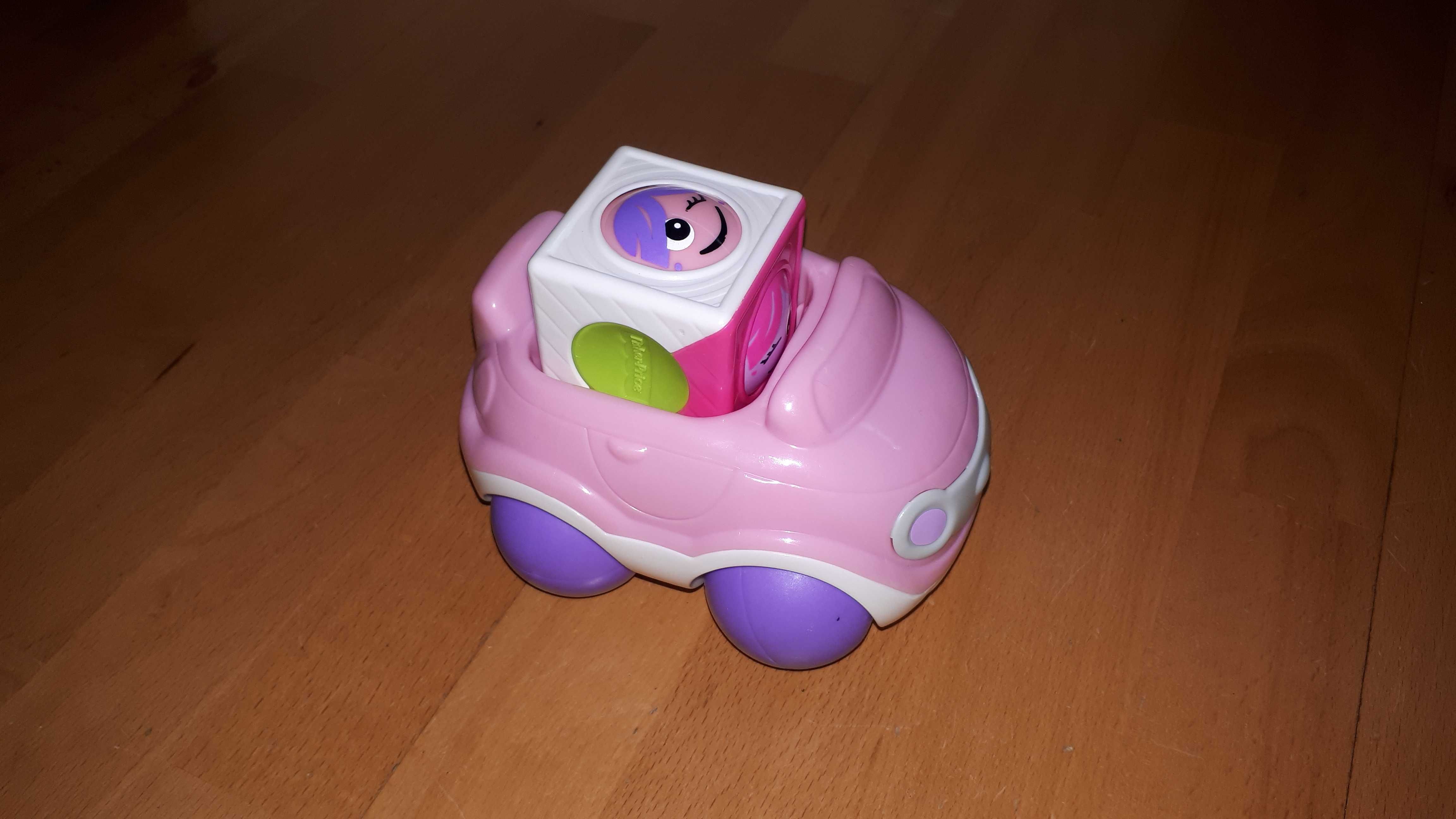 Różowe autko firmy Fisher-price