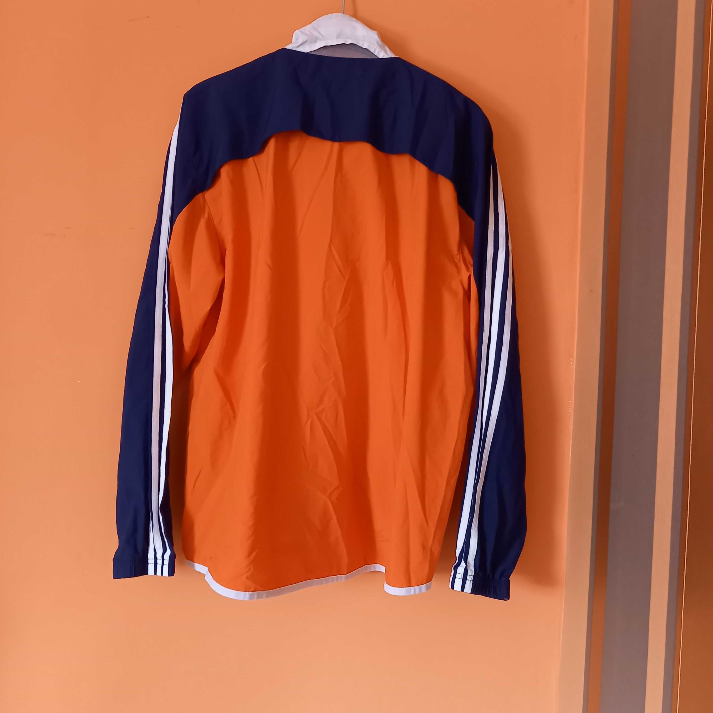 pomarańczowa wiatrówka kurtka adidas