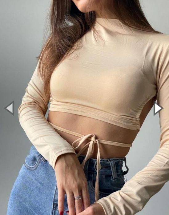 Бежевий топ з оголеною спинкою 
Розмір - М 
Стан - нової 
Ціна -200г