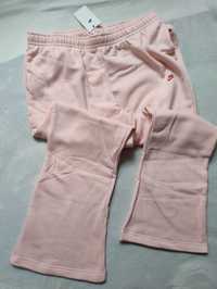 Różowe polarowe spodnie damskie z rozszerzanymi nogawkami Nike LOVE XL