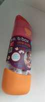 Różowo pomarańczowa butelka bbox