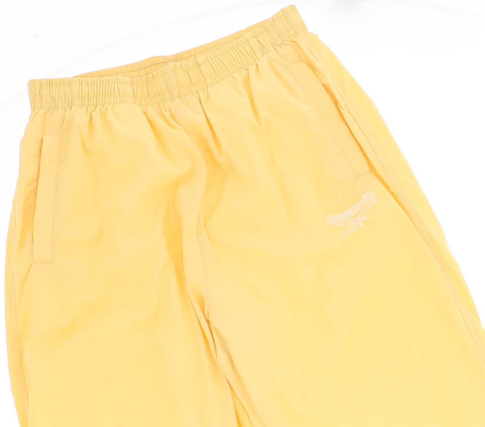 Żółte spodnie sportowe marki Reebok, rozmiar 40