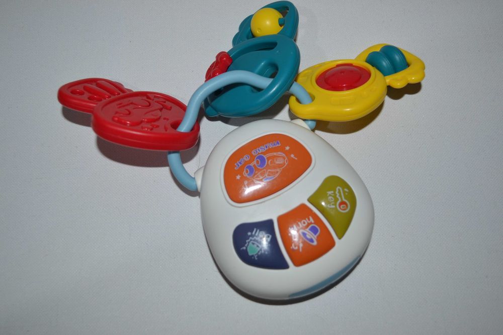 Розпродаж Музична іграшка брязкальце зі світловими ефектами Брелок з к