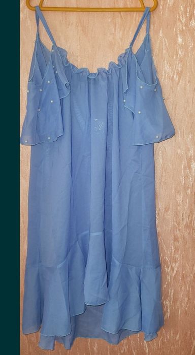 Туника парео с воланом на плечах и жемчугом 44р
Длина 88
Пог 44