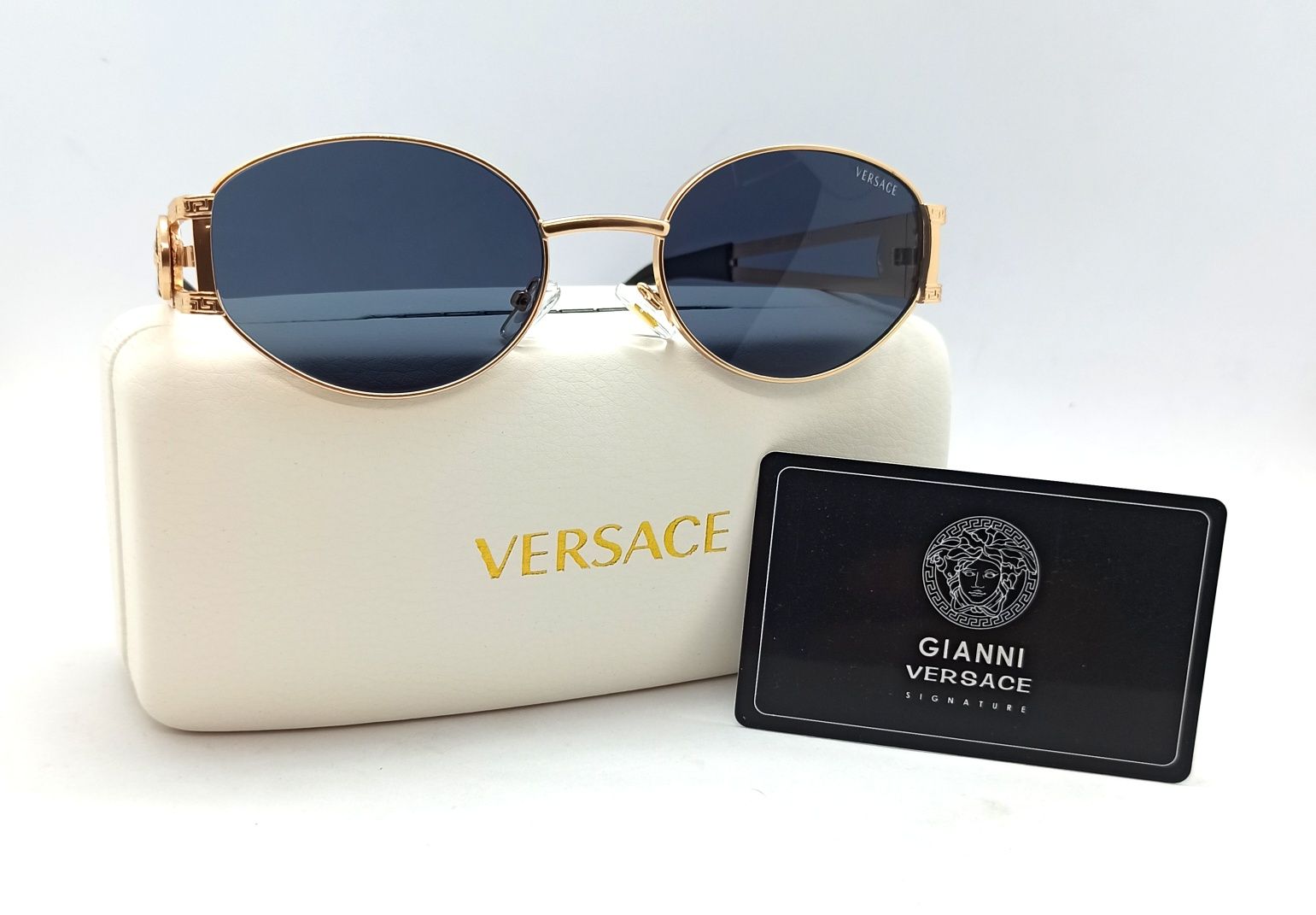Versace стильные унисекс очки черные овальные в золотом металле VE6747