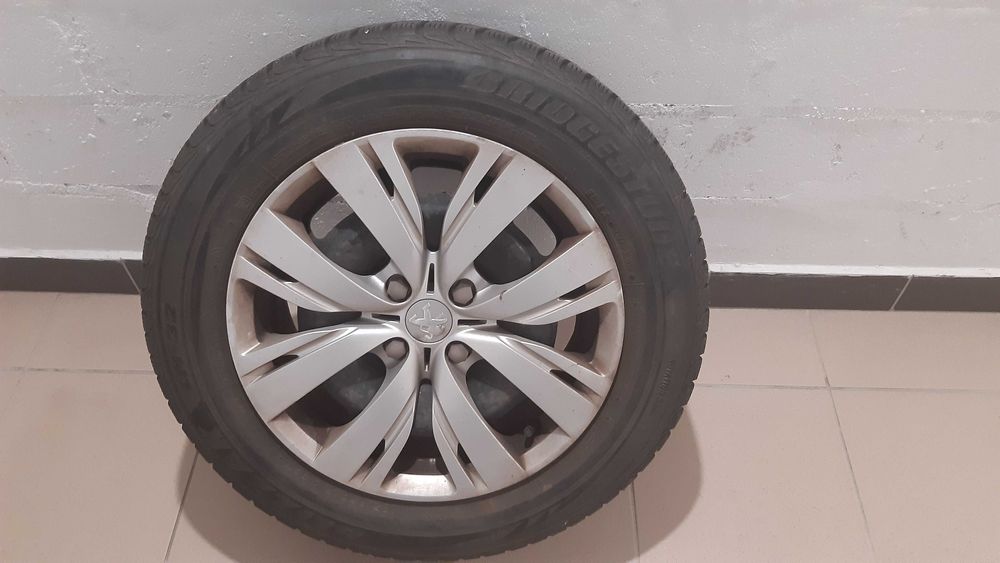 Felgi stalowe 15" z op. zimowymi 185/65 R15 + oryg.kołpaki Peugeot 208