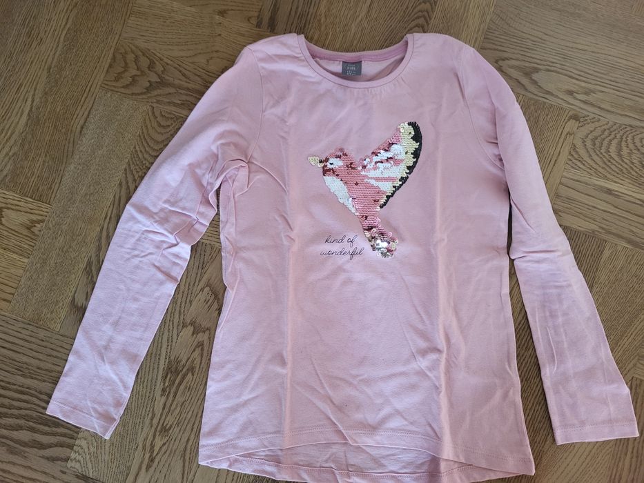 Bluzka z długim rękawem. Ptak z cekinów. Rozm. 134. 2 sztuki