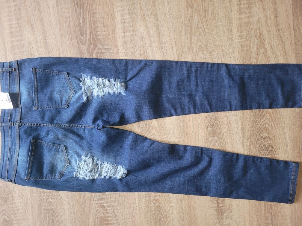 Nowe spodnie jeansy rozmiar 44