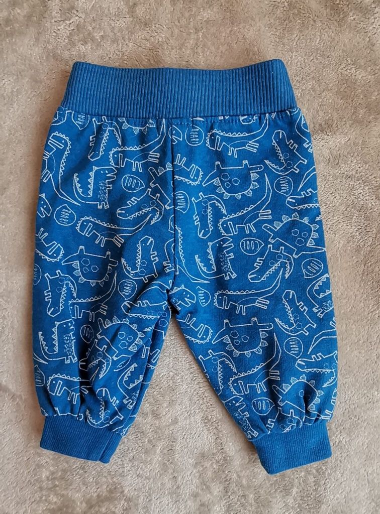 Niebieskie spodnie dresowe chłopięce 68 dinusie dinozaury