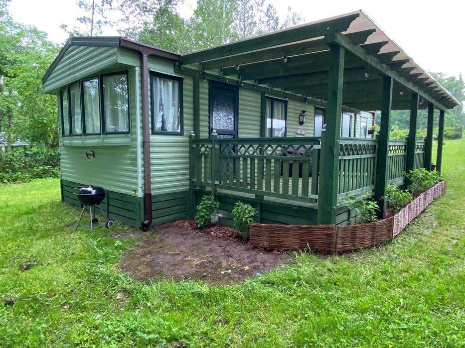 Domek nad jeziorem Ublik Wyszowate linia brzegowa pomost łódka