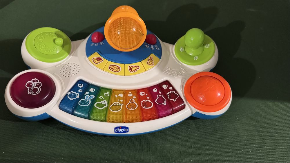 Дуга  на коляску сортер жук вертоліт піаніно тварин chico 1 2 роки 9