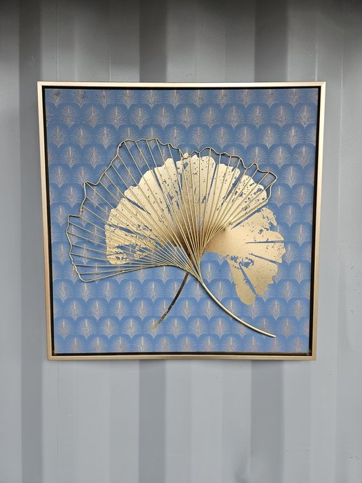 Obraz Złote liście na turkusie złota rama