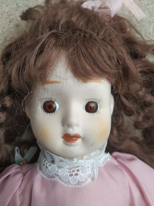 Bonecas em porcelana